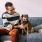 man sitting on a couch with a dog
