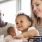 parents eat breakfast with their young children